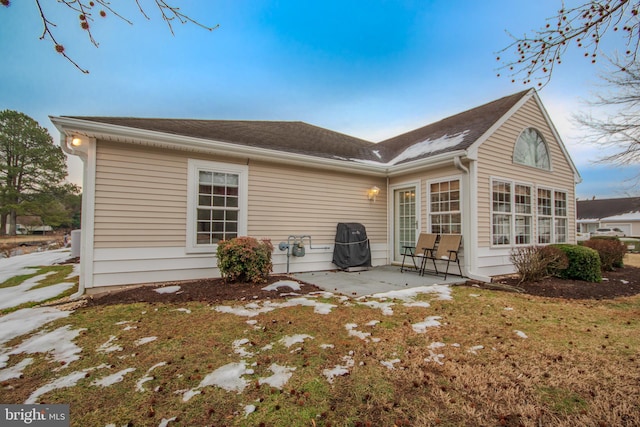 rear view of house with a patio