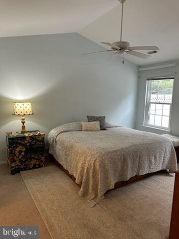 bedroom featuring ceiling fan, carpet, and vaulted ceiling