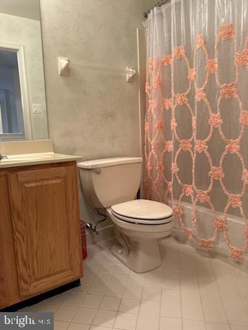 bathroom with tile patterned floors, toilet, vanity, and a shower with shower curtain