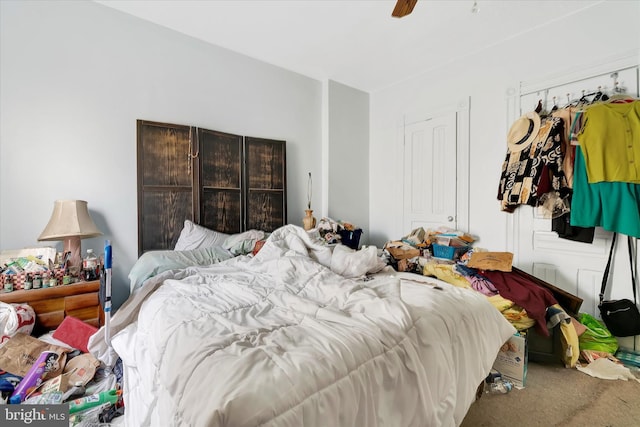 carpeted bedroom with ceiling fan