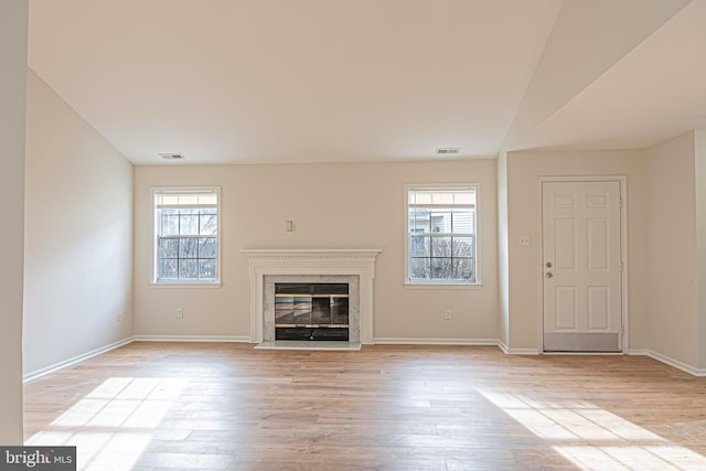 unfurnished living room featuring light hardwood / wood-style floors