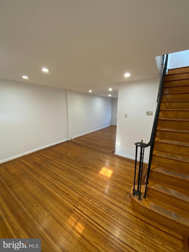 basement featuring dark wood-type flooring