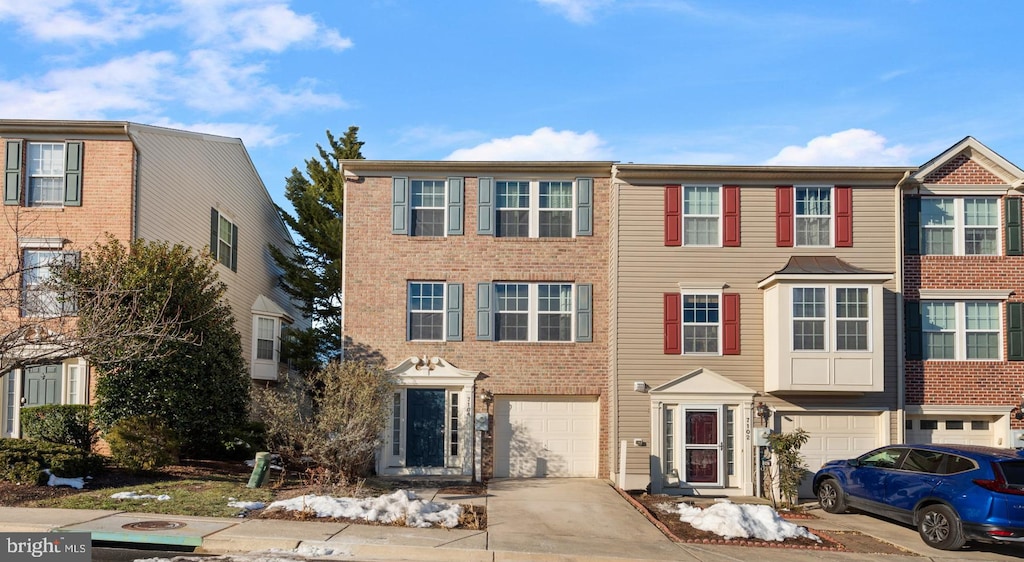 multi unit property featuring a garage