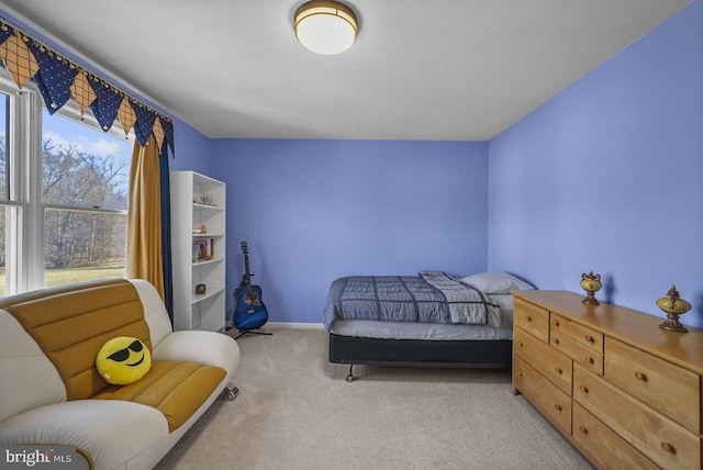 bedroom with light colored carpet