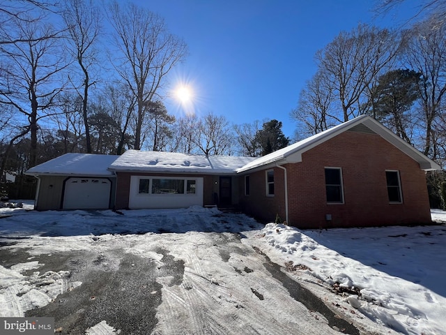 single story home with a garage