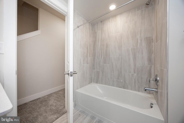 bathroom with shower / washtub combination