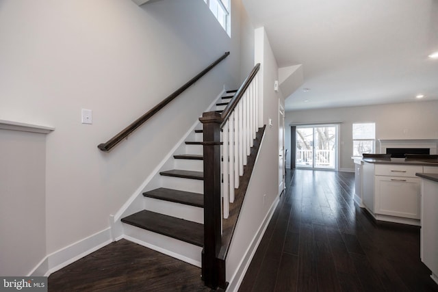 stairway with wood-type flooring