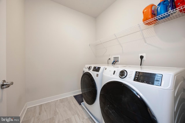 laundry room with washer and clothes dryer