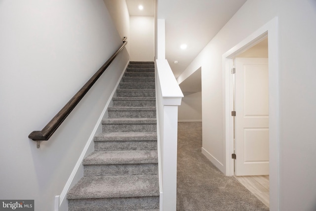 stairs with carpet flooring