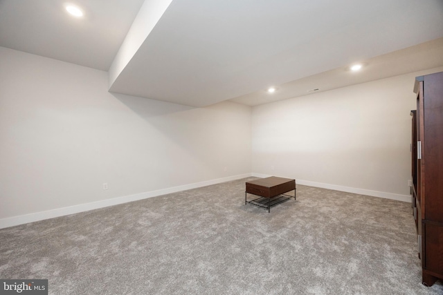 interior space featuring light carpet