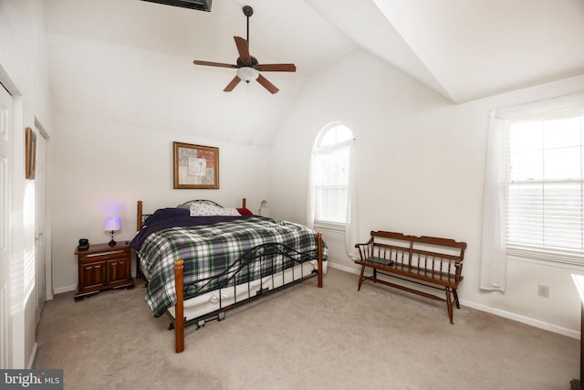 bedroom featuring vaulted ceiling and light colored carpet