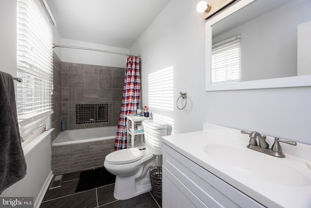 full bathroom featuring tile patterned floors, toilet, shower / tub combo, vanity, and a tiled fireplace