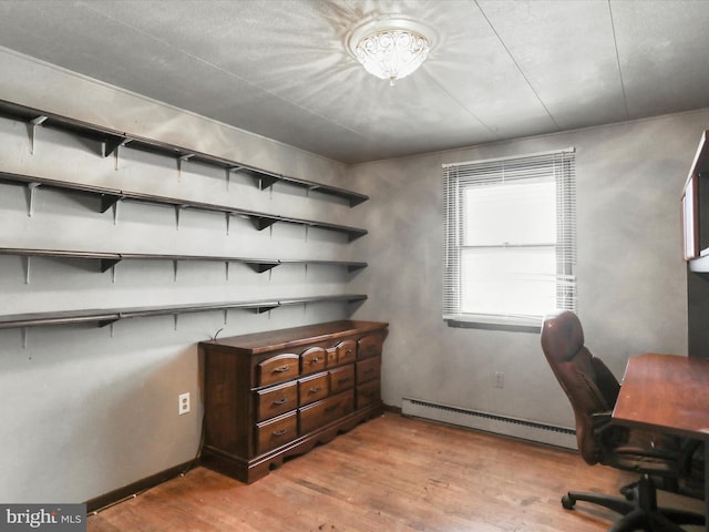 home office featuring light hardwood / wood-style floors and baseboard heating