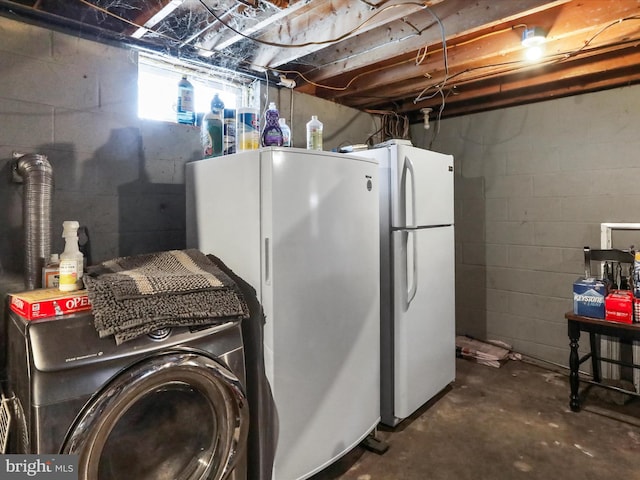 washroom with washer / dryer