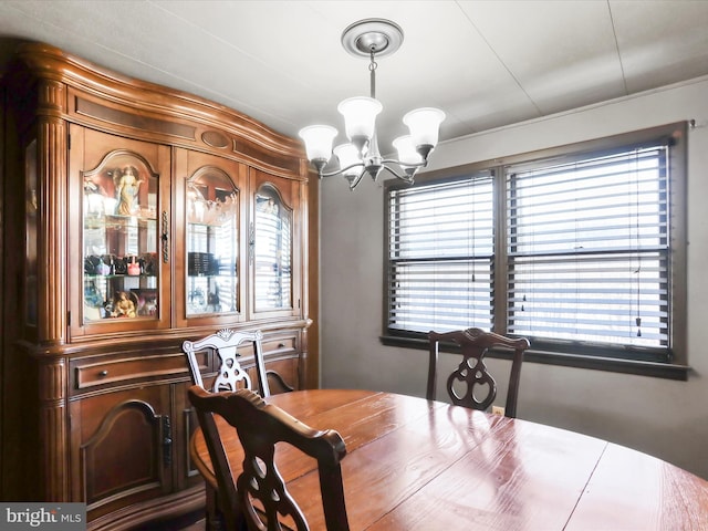 dining space with an inviting chandelier