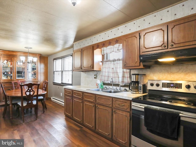 kitchen featuring sink, hanging light fixtures, dark hardwood / wood-style floors, electric stove, and a baseboard heating unit