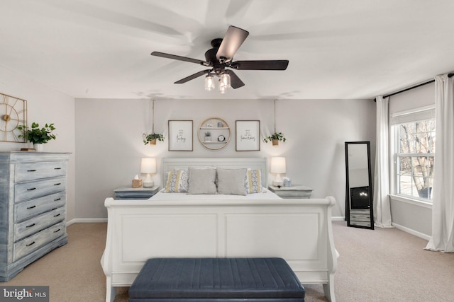 bedroom with light carpet and ceiling fan