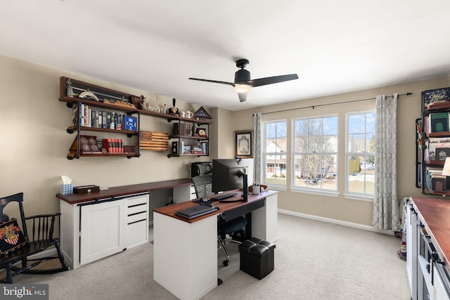 office with light colored carpet and ceiling fan