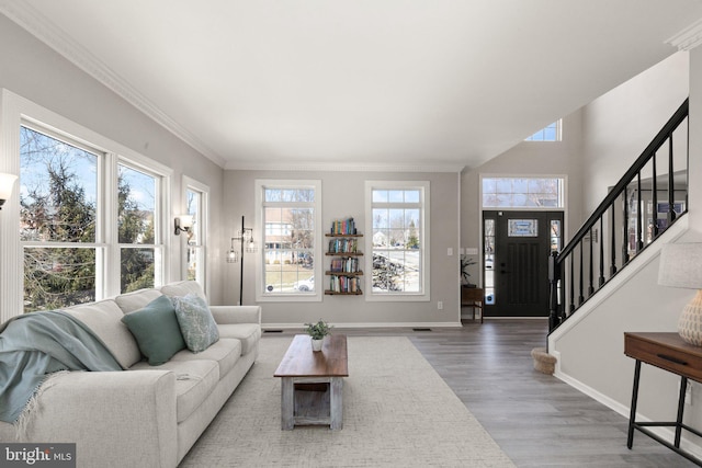 living room with hardwood / wood-style floors and crown molding