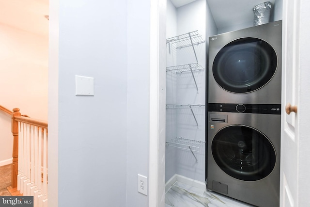 laundry room with stacked washing maching and dryer