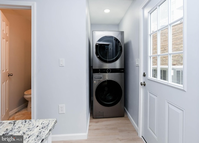 laundry room featuring stacked washer and dryer