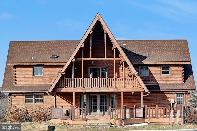 back of house with a balcony