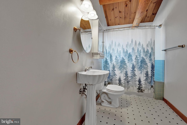 bathroom featuring toilet, a shower with shower curtain, and wooden ceiling