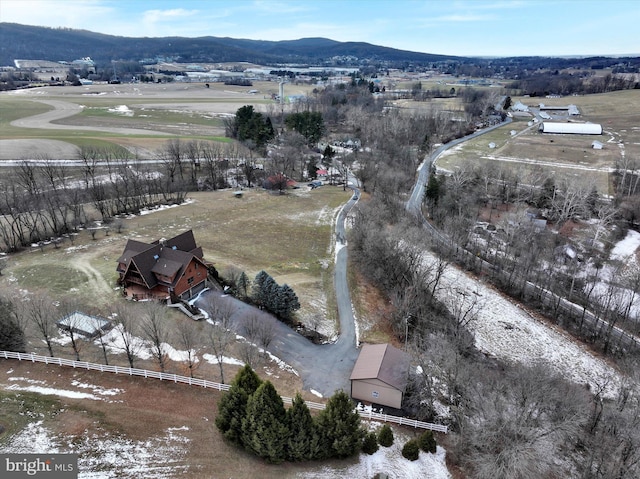 birds eye view of property with a mountain view and a rural view