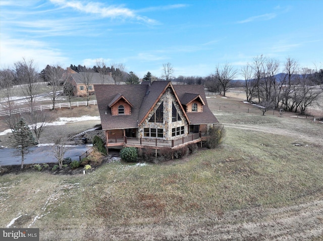 back of property featuring a lawn