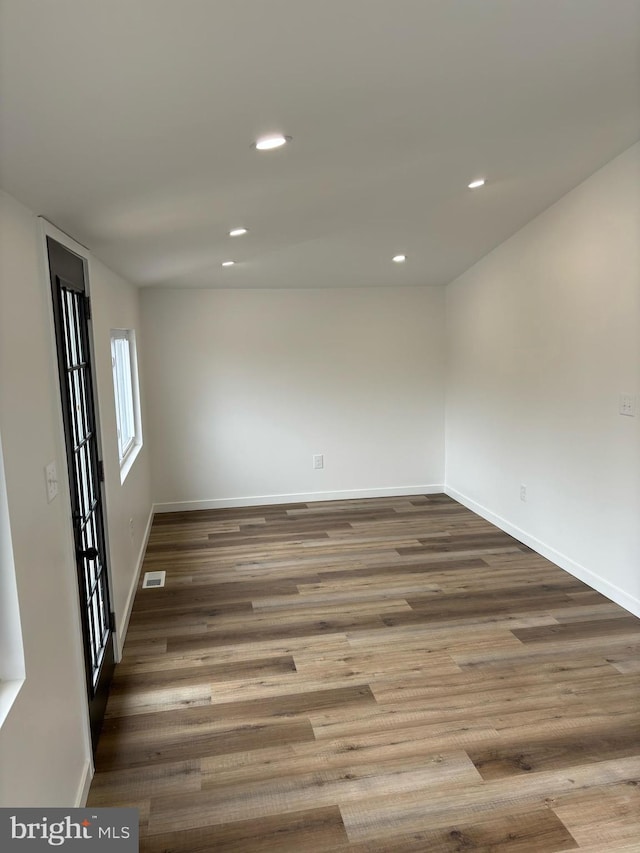 empty room with wood-type flooring