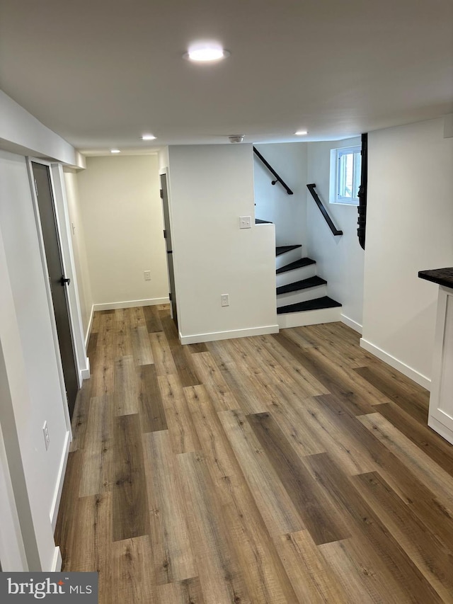 basement featuring light hardwood / wood-style flooring