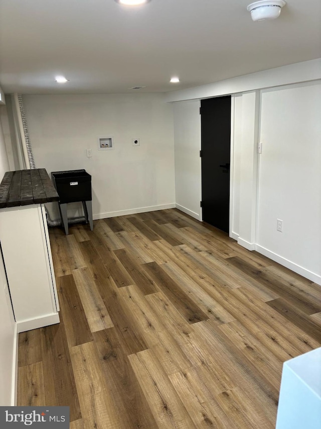 spare room with light hardwood / wood-style floors