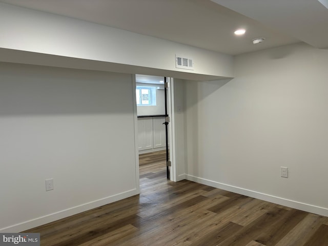 basement with dark wood-type flooring