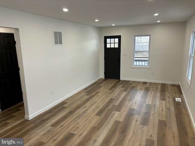 foyer entrance with hardwood / wood-style flooring