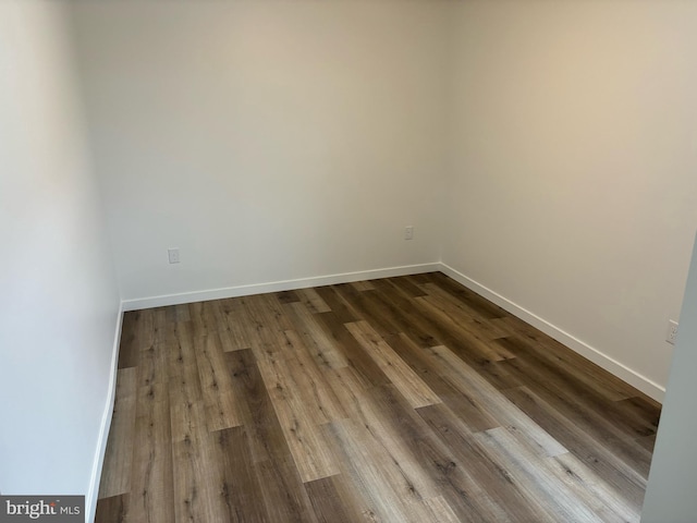 empty room featuring wood-type flooring