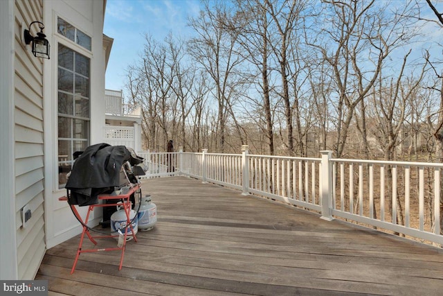 wooden terrace with area for grilling