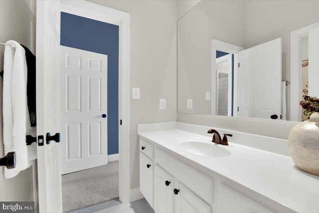 bathroom with baseboards and vanity