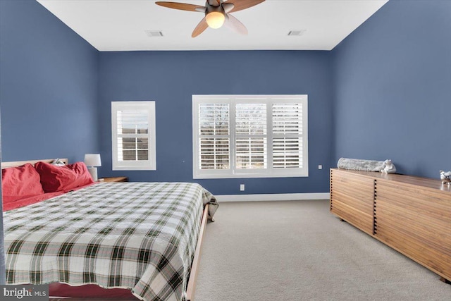 bedroom featuring visible vents, baseboards, a ceiling fan, and carpet flooring