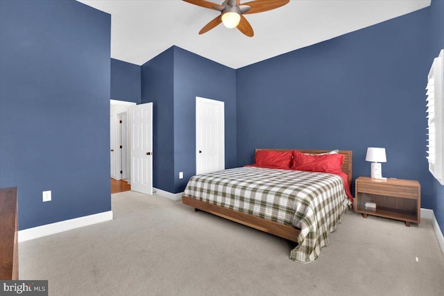 bedroom with carpet, baseboards, and ceiling fan