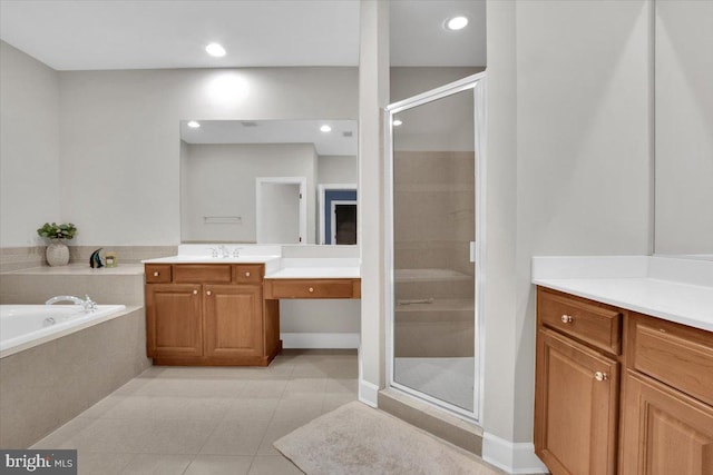 bathroom with vanity, tile patterned floors, a bath, and a stall shower