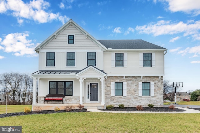 view of front facade with a front lawn and a porch