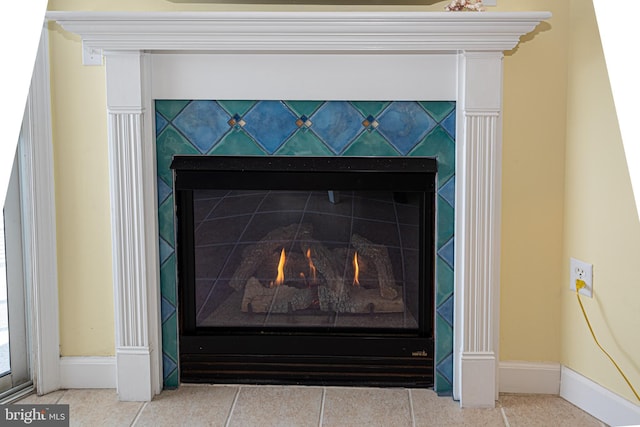 details featuring a tile fireplace