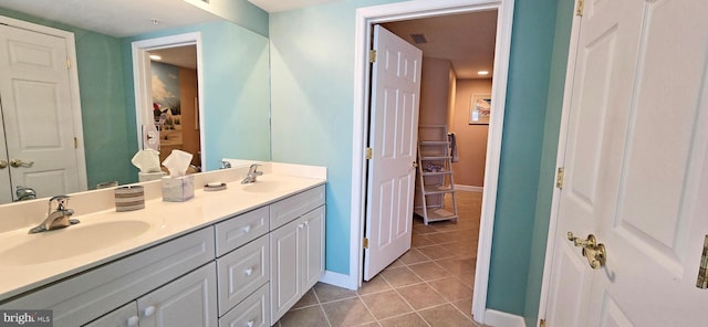 bathroom featuring tile patterned flooring and vanity