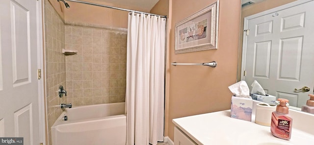 bathroom featuring vanity and shower / bathtub combination with curtain