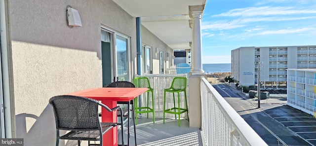 balcony featuring a water view