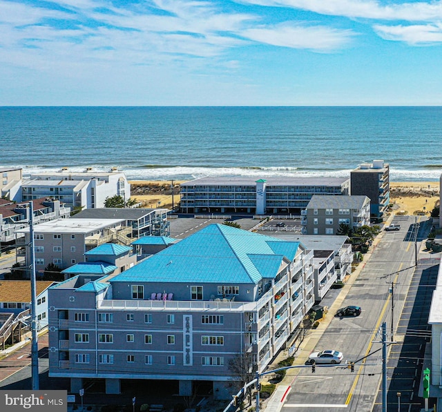 aerial view featuring a view of the beach and a water view