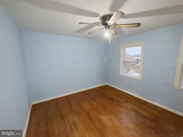 unfurnished room featuring hardwood / wood-style flooring and ceiling fan