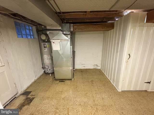 basement featuring heating unit and water heater