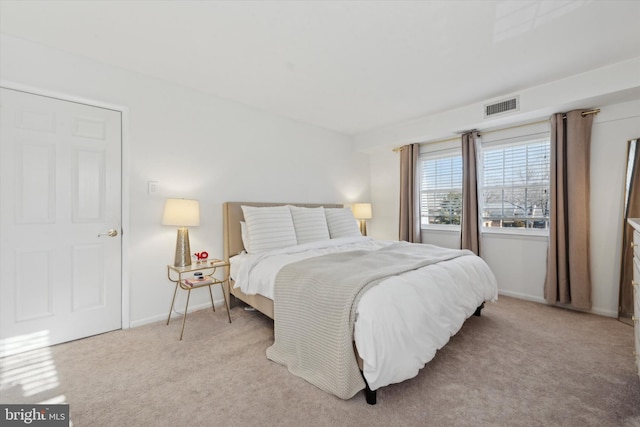 bedroom with light colored carpet