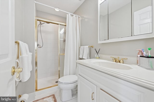 bathroom with tile patterned floors, toilet, walk in shower, and vanity